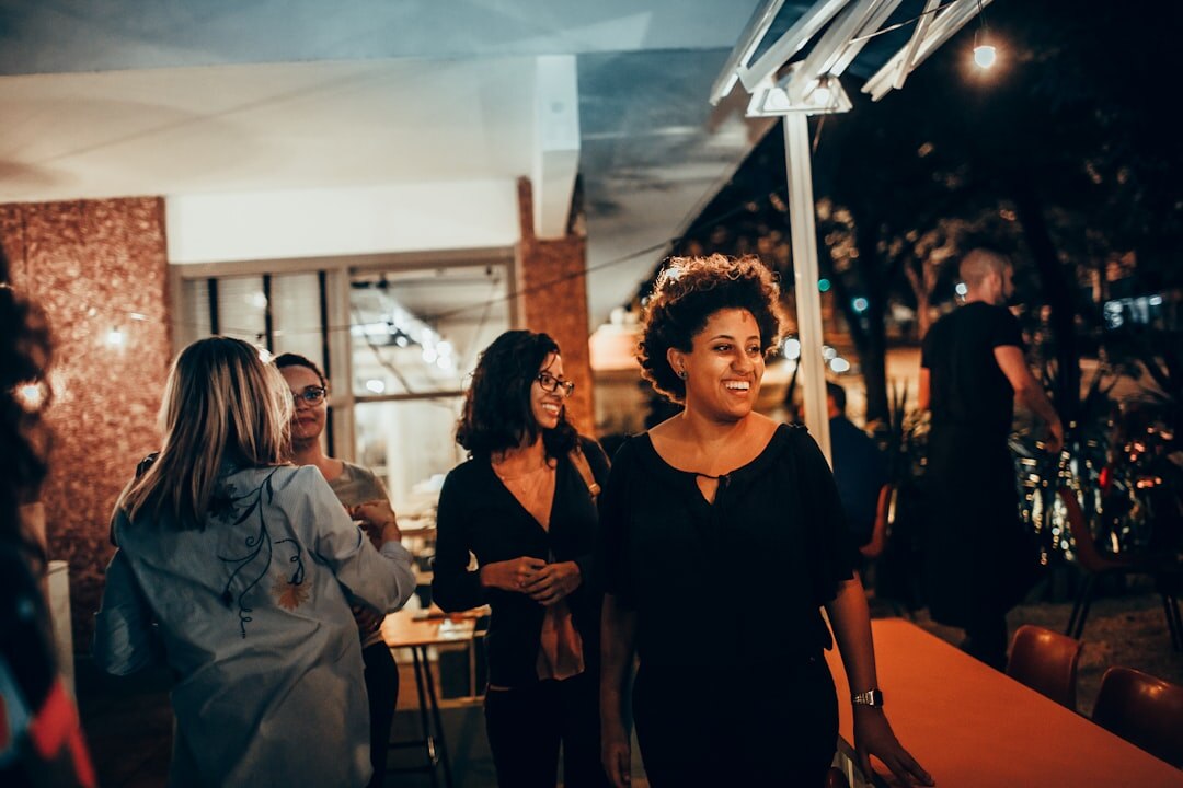 Business professionals connecting at an evening networking reception