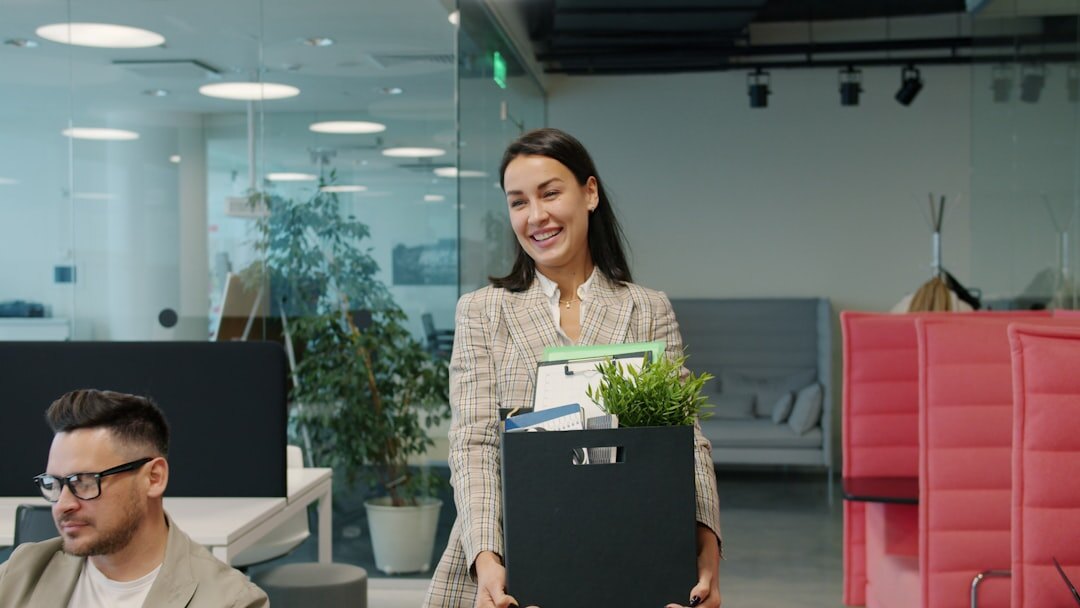 Diverse group of business professionals walking and talking in an office corridor